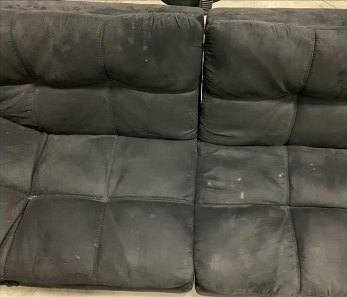 Black futon covered in ashes