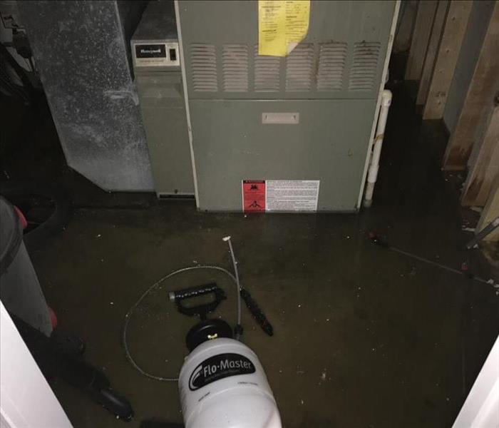 Basement with sewage everywhere on concrete floor